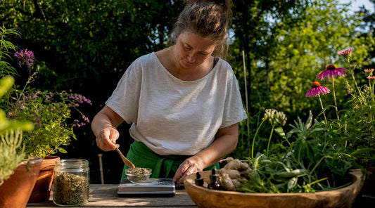 Woman preparing natural herbal supplements at home
