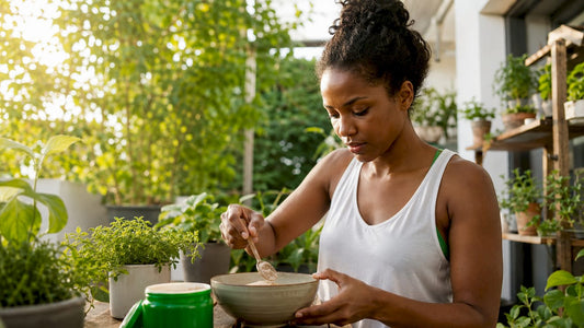 Woman preparing a natural workout supplement in kitchen