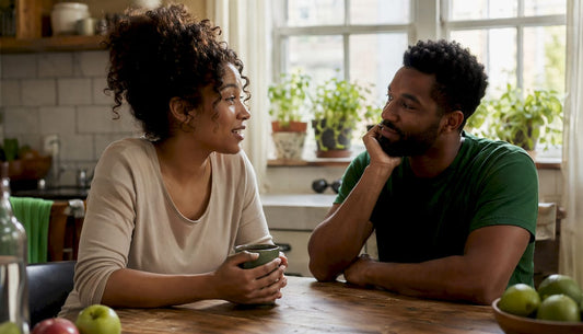 Couple sharing honest conversation in their living room