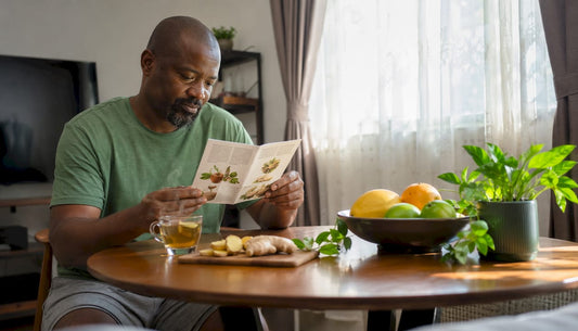 Man reading natural erection remedies brochure at home